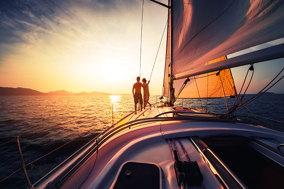 Image description: People on boat at sunset