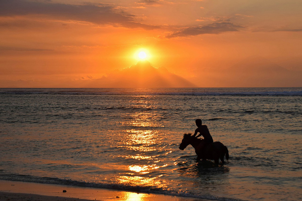 gili island sunset behind mount agung bali